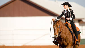 Cowgirl Riding A Horse Wallpaper