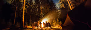 Cozy Campsite Surrounded By Autumn Foliage Wallpaper