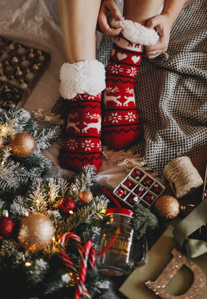 Cozy Christmas Aesthetic Red Socks Wallpaper