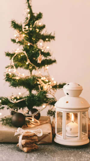 Cozy Christmas Decorwith Lanternand Tree.jpg Wallpaper