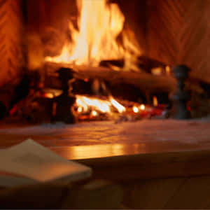 Cozy Fire In A Rustic Fireplace Wallpaper