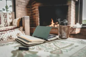Cozy Fireplace Writing Session Wallpaper