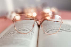 Cozy Reading Glasses And Book.jpg Wallpaper