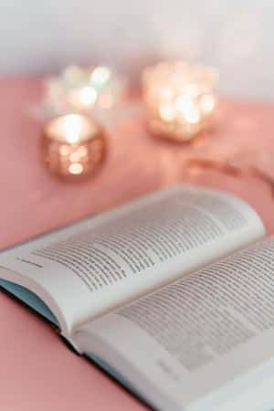 Cozy Reading Timewith Candlelight Wallpaper