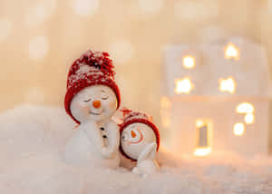 Cozy Snowman Family Winter Wonderland Wallpaper