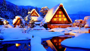 Cozy Winter Cabin Nestled In Snowy Forest Wallpaper