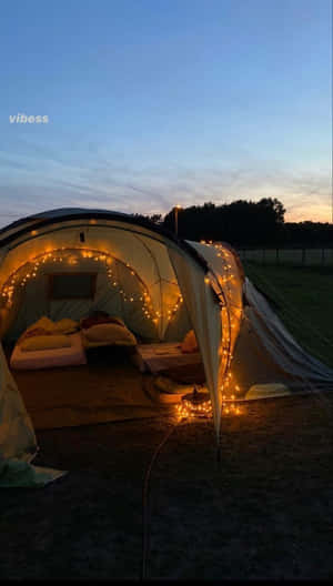 Cozy Winter Camping Under The Stars Wallpaper