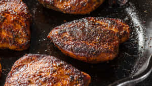 Crafted With A Spice Blend And Cooked To Juicy Perfection, This Blackened Chicken Is Delicious. Wallpaper