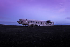 Crashed Plane On Desert Land Wallpaper