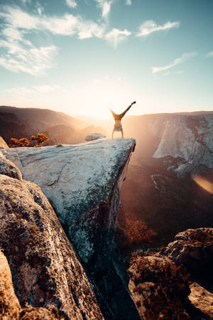 Crazy Handstand On Cliff Wallpaper