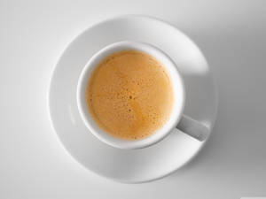 Creamy Coffee In A Coffee Cup Wallpaper