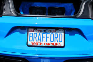 Creative Car License Plate On A Brightly Colored Vehicle Wallpaper