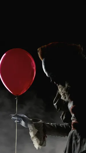 Creepy_ Clown_with_ Balloon_ Halloween_ Lockscreen Wallpaper
