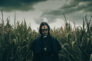 Creepy_ Priest_in_ Cornfield Wallpaper