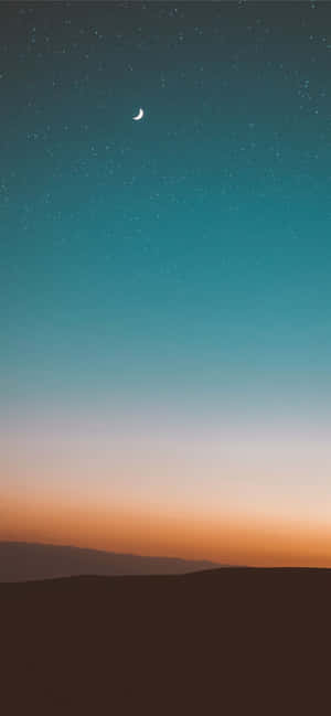 Crescent_ Moon_ Over_ Twilight_ Desert Wallpaper