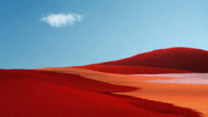 Crimson_ Dunes_ Under_ Blue_ Sky Wallpaper