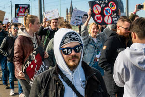 Crowd Of People At The Street Rallying Wallpaper