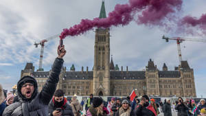 Crowd Of People Gathered In Ottawa Parliament Hill Wallpaper