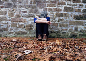 Crying Sad Boy On Wall Wallpaper