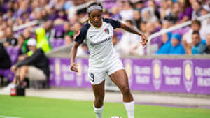 Crystal Dunn Displays Her Amazing Soccer Skills On The Field Wallpaper