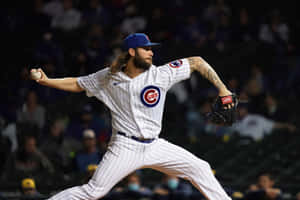 Cubs Pitcherin Actionat Night Game Wallpaper