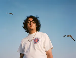 Cuco In White Shirt Wallpaper