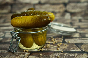 Cucumber Pickles In Tiny Jar Wallpaper