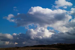 Cumulus Clouds And Hills Horizon Wallpaper