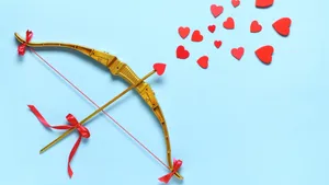 Cupid Arrow With Heart Shapes Wallpaper
