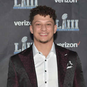 Curly Haired Boyin Suitat Event Wallpaper