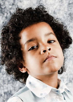 Curly Haired Boywith Light Skin Wallpaper