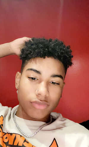 Curly Haired Boywith Nose Ring Wallpaper