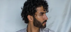 Curly Haired Man Profile View Wallpaper