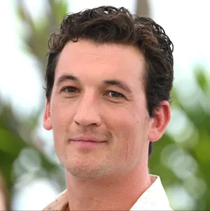 Curly Haired Man Smiling Wallpaper