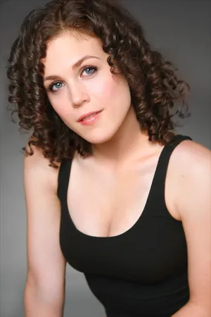 Curly Haired Woman In Black Tank Top Wallpaper