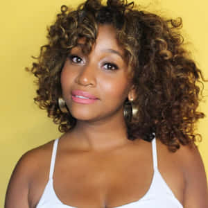 Curly Haired Woman With Hoop Earrings Wallpaper