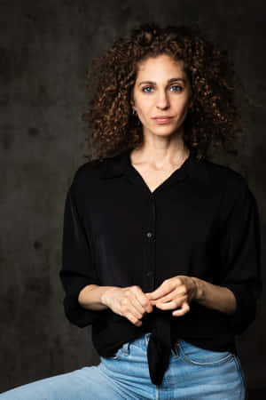 Curly Haired Womanin Black Shirt Wallpaper