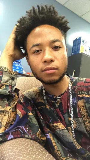 Curly Haired Young Manin Office Wallpaper