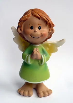 Cute Angel Figurine In A Green Dress Wallpaper