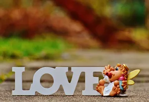 Cute Angel With Love Signage Wallpaper