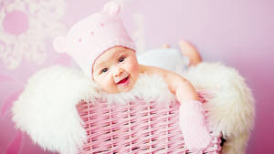 Cute Baby Girl In Pink Basket Wallpaper