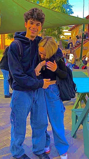 Cute Boyfriend Sharing A Heartfelt Moment With His Girlfriend Wallpaper