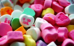 Cute Candies Cut In Hearts Wallpaper