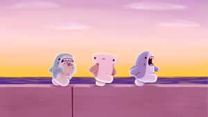 Cute Cartoon Sharks At Sunset Wallpaper
