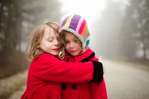 Cute Kid Gazing At Nature With A Smile Wallpaper