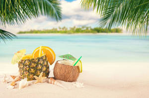 Cute Summer Drink At Beach Wallpaper