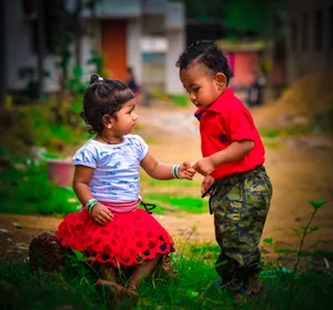 Cute Toddler Smiling In Nature Wallpaper