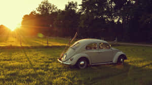 Cute Vintage Car With Sun Wallpaper