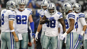 Dak Prescott, Ezekiel Elliott, And Amari Cooper Of The Dallas Cowboys Celebrate A Touchdown Wallpaper