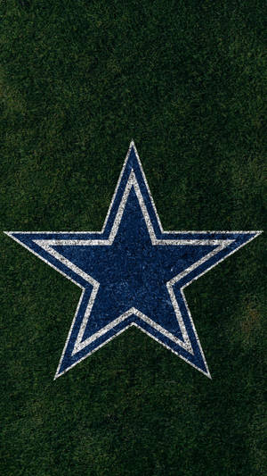 Dallas Cowboys Logo In Grass For Phones Wallpaper